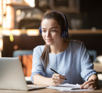 a woman studying in front of her laptop